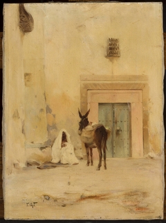 Arab and a donkey at the wall of a house by Tadeusz Ajdukiewicz
