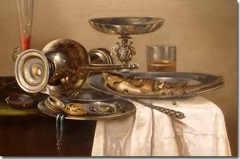 Still life of tazza, overturned decanter, fish, wine glass, beer glass and knife on a draped table