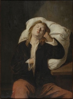 A Boy Sleeping against a Pillow