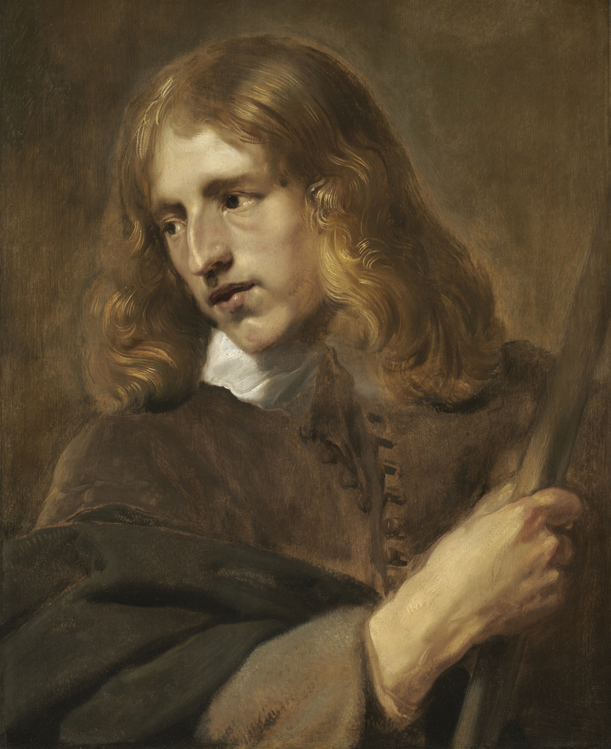 A Young Man Holding a Staff
