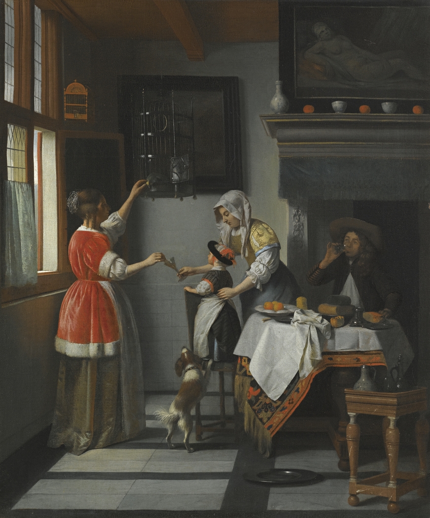 Interior with man drinking and two woman with a child feeding a parrot