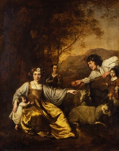 Portrait of a family in shepherd costumes with sheep