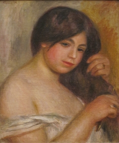 Woman Combing her Hair by Auguste Renoir