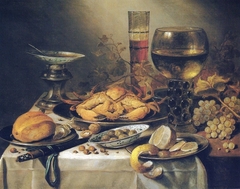 Still life with a crab, grapes, olives, and a peeled lemon by Pieter Claesz