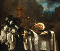 Still life with ham in a landscape