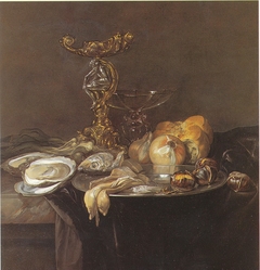 Still life with Orpheus salt cellar, fish, onions, bread, chestnuts and oysters, ca. 1680