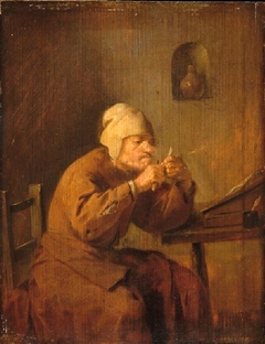 A Man Cutting a Pen