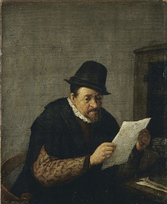 A Man Reading a Paper