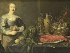 A young woman near a table with fruits