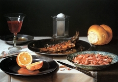 Breakfast still life with herring, shrimp, bread, orange and red wine by Pieter Claesz