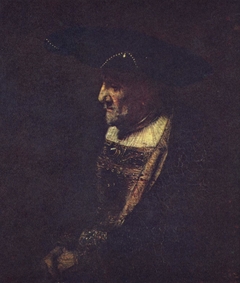 Man with a hat decorated with pearls