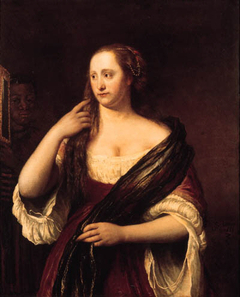 Portrait of a young woman looking into a mirror, holded by a black servant