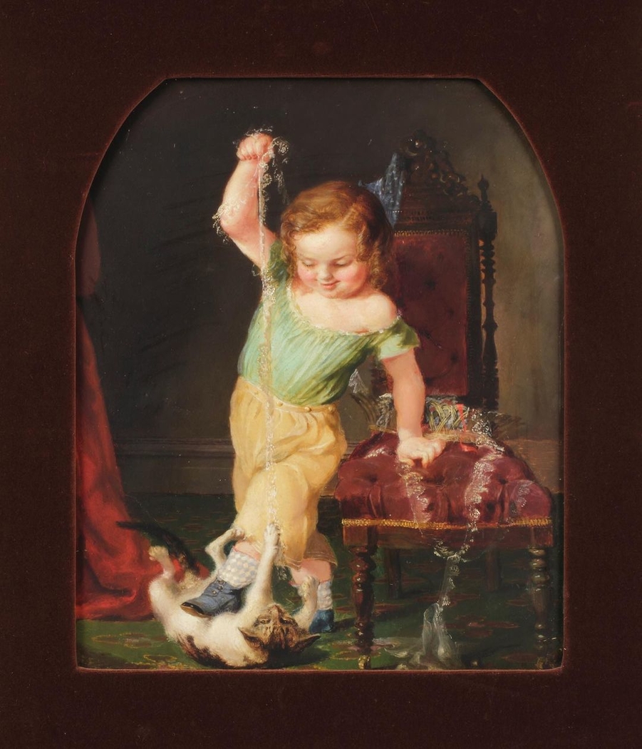 Child Playing with Cat
