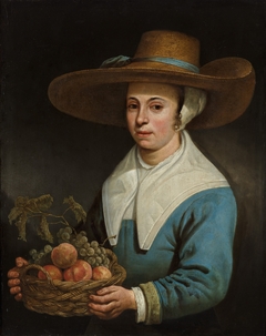 Girl with a straw hat, with a basket of grapes