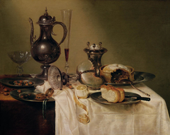 Still life with decanter, nautilus cup, wine glasses and pie by Willem Claesz Heda