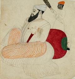 A fat, bearded ruler seated against a bolster, attended by a black chauri beare by Anonymous