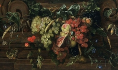A festoon of fruit and some small flowers