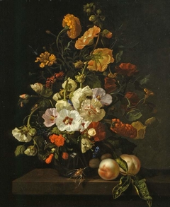 Flowers in a glass vase, with insects and peaches, on a marble tabletop