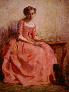 Girl in a Pink Dress Sitting at a Table with a Dog