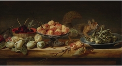 Still life with peaches in a Tazza, hazelnuts on a pewter plate, raspberries in a basket, with pears and a squirrel on a table