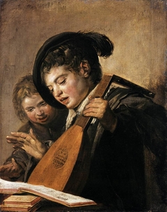 Two singing boys with a lute and a music book