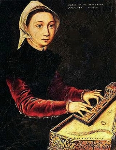 Young woman playing a virginal