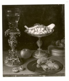 A roemer on a silver-gilt bekerschroef, sweetmeats in a silver tazza, langoustines on a plate, walnuts and an apple on a table top by Jeremias van Winghe