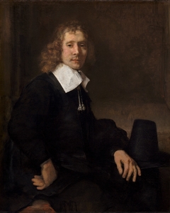 A Young Man Seated at a Table (possibly Govaert Flinck) by Rembrandt
