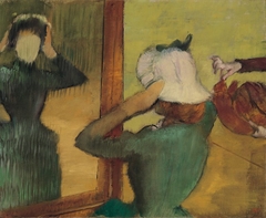 At the Milliner by Edgar Degas