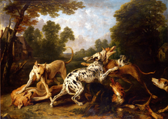 Dogs fighting in a wooded clearing