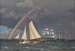 Rainbow at sea with some cruising ships