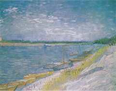 River landscape with rowing boats on the shore