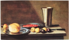 Still life with fruit, bread and a silver chalice
