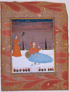 Woman seated on a terrace with an attendant with a chauri